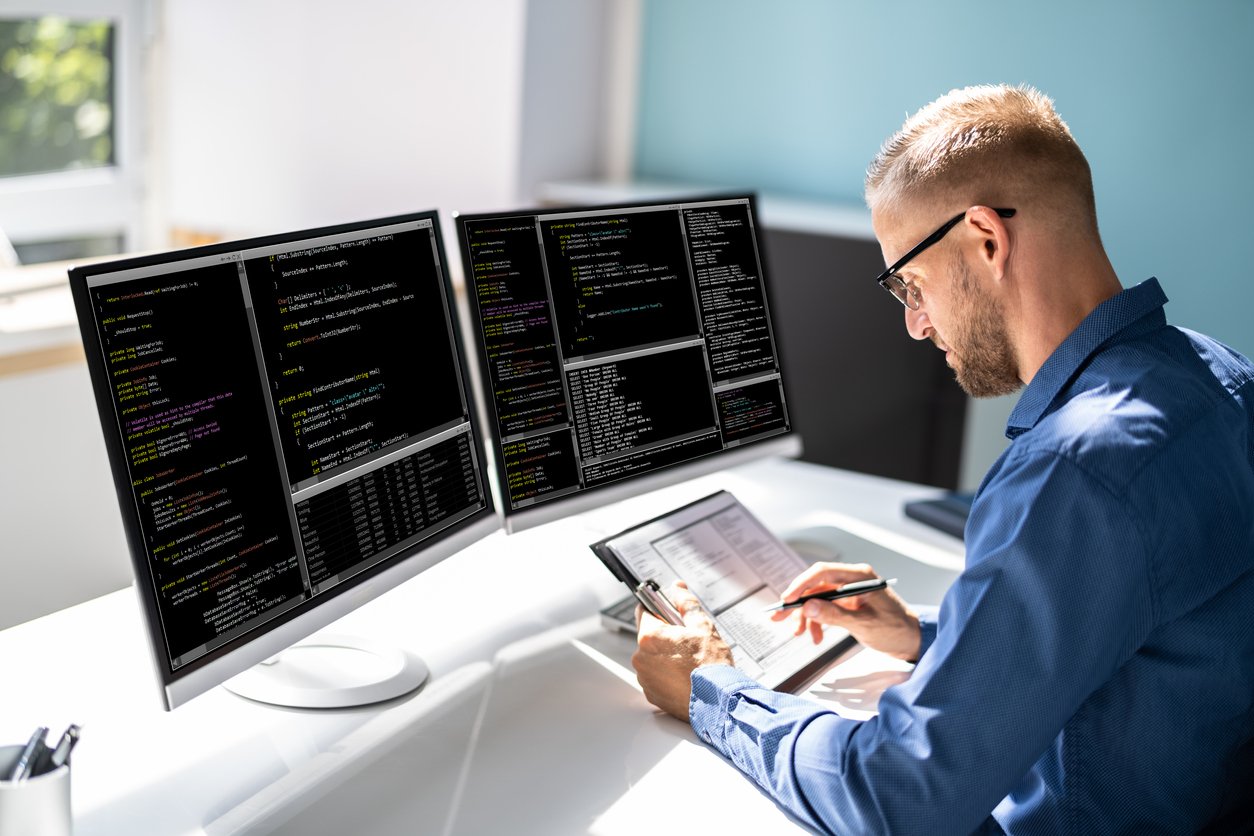 IT professional working on computer codes.