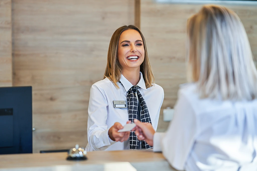 employee at front desk of an apartment complex