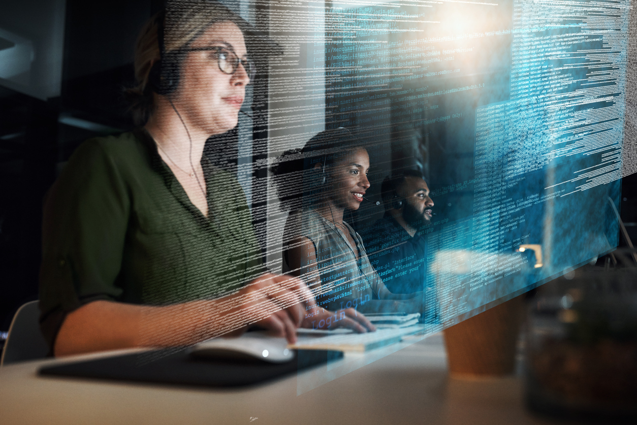 Group of MSPs employees working on computers while assisting clients.